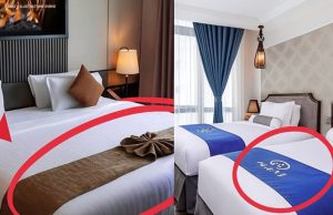 Čemu zapravo služi uska traka od tkanine preko hotelskog kreveta? Čemu zapravo služi uska traka od tkanine preko hotelskog kreveta? - featured image